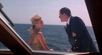Movie still from “Overboard” (1987), directed by Garry Marshall – A man and a woman on a boat in the ocean; Medium shot, Low angle
