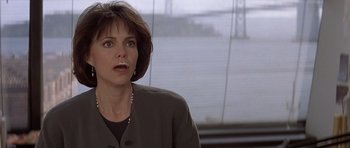 Movie still from “Mrs. Doubtfire” (1993), directed by Chris Columbus – An image of a woman in a gray jacket; Close Up shot, Low angle