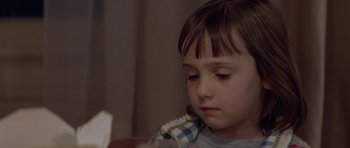 Movie still from “Mrs. Doubtfire” (1993), directed by Chris Columbus – A little girl sitting in front of a table; Close Up shot, Over the shoulder angle