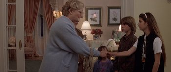 Movie still from “Mrs. Doubtfire” (1993), directed by Chris Columbus – Two women and a little girl in a living room; Medium shot, Over the shoulder angle