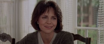 Movie still from “Mrs. Doubtfire” (1993), directed by Chris Columbus – A person wearing a sweater; Close Up shot, Over the shoulder angle