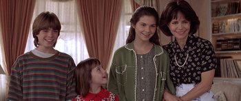 Movie still from “Mrs. Doubtfire” (1993), directed by Chris Columbus – A group of young people standing next to each other; Close Up shot, Over the shoulder angle