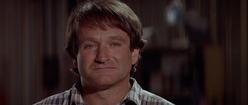 Movie still from “Mrs. Doubtfire” (1993), directed by Chris Columbus – A person wearing a plaid shirt; Close Up shot, Over the shoulder angle