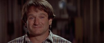 Movie still from “Mrs. Doubtfire” (1993), directed by Chris Columbus – A person wearing a plaid shirt; Close Up shot, Over the shoulder angle