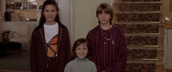 Movie still from “Mrs. Doubtfire” (1993), directed by Chris Columbus – A group of young people standing next to each other; Medium shot, Low angle
