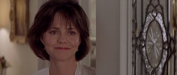 Movie still from “Mrs. Doubtfire” (1993), directed by Chris Columbus – A person with short brown hair; Close Up shot, Over the shoulder angle
