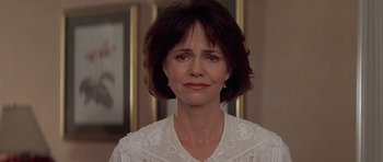 Movie still from “Mrs. Doubtfire” (1993), directed by Chris Columbus – A person wearing a white shirt; Close Up shot, Over the shoulder angle