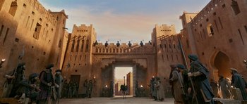 Movie still from “Padmaavat” (2018), directed by Sanjay Leela Bhansali – An image of an ancient building with a horse and rider in it; Extreme Wide shot, Low angle