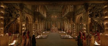 Movie still from “Padmaavat” (2018), directed by Sanjay Leela Bhansali – A group of people standing in a large room with pillars; Extreme Wide shot, High angle