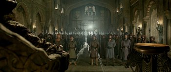 Movie still from “Padmaavat” (2018), directed by Sanjay Leela Bhansali – A group of people standing in front of an audience; Wide shot, Low angle