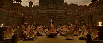 Movie still from “Padmaavat” (2018), directed by Sanjay Leela Bhansali – A group of women in traditional indian garb dancing; Extreme Wide shot, High angle