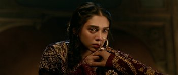 Movie still from “Padmaavat” (2018), directed by Sanjay Leela Bhansali – A young woman holding a phone in her hand; Close Up shot, High angle