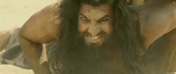 A person with long hair and a beard