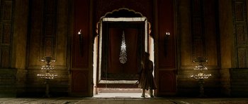 Movie still from “Padmaavat” (2018), directed by Sanjay Leela Bhansali – A person standing in front of a doorway; Extreme Wide shot, Low angle