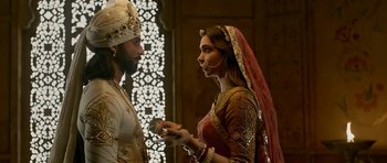 Movie still from “Padmaavat” (2018), directed by Sanjay Leela Bhansali – A man and a woman dressed in traditional indian garb; Medium shot, Over the shoulder angle