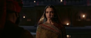Movie still from “Padmaavat” (2018), directed by Sanjay Leela Bhansali – A woman in a sari with a nose ring; Close Up shot, Over the shoulder angle