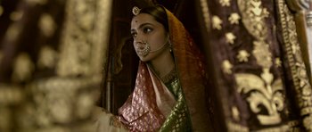 Movie still from “Padmaavat” (2018), directed by Sanjay Leela Bhansali – A woman with a nose ring in a sari; Close Up shot, Low angle