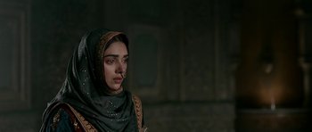 Movie still from “Padmaavat” (2018), directed by Sanjay Leela Bhansali – A woman in a headscarf and a nose ring looking to her left; Close Up shot, Over the shoulder angle