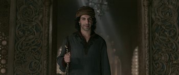 Movie still from “Padmaavat” (2018), directed by Sanjay Leela Bhansali – A man with a beard holding a staff in his hand; Medium shot, Over the shoulder angle
