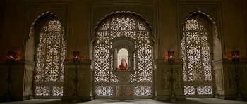 Movie still from “Padmaavat” (2018), directed by Sanjay Leela Bhansali – A woman sitting in an ornate window in an ornate room; Wide shot, Low angle