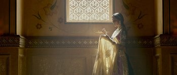 Movie still from “Padmaavat” (2018), directed by Sanjay Leela Bhansali – A woman standing in front of an open window; Medium shot, Low angle