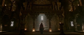 Movie still from “Padmaavat” (2018), directed by Sanjay Leela Bhansali – A man in a red robe standing in front of an altar; Extreme Wide shot, Low angle