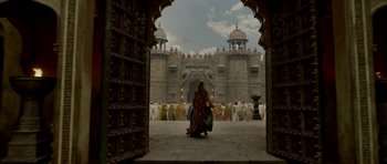 Movie still from “Padmaavat” (2018), directed by Sanjay Leela Bhansali – A group of people standing in front of a building; Extreme Wide shot, Low angle