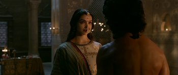 Movie still from “Padmaavat” (2018), directed by Sanjay Leela Bhansali – A woman with a nose ring on her head; Medium shot, Over the shoulder angle