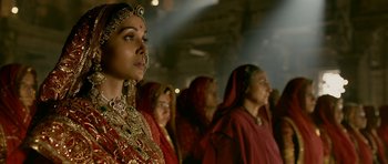 Movie still from “Padmaavat” (2018), directed by Sanjay Leela Bhansali – A group of women dressed in traditional indian clothing; Close Up shot, Over the shoulder angle
