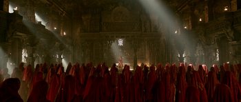 Movie still from “Padmaavat” (2018), directed by Sanjay Leela Bhansali – A group of people dressed in red in front of an audience; Extreme Wide shot, High angle