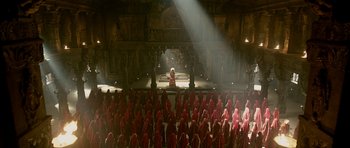 Movie still from “Padmaavat” (2018), directed by Sanjay Leela Bhansali – A group of people in red robes in front of an audience; Extreme Wide shot, High angle