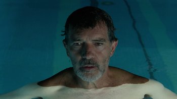 Movie still from “Pain and Glory” (2019), directed by Pedro Almodóvar – A person in a swimming pool; Close Up shot, Low angle