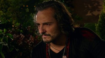 Movie still from “Pain and Glory” (2019), directed by Pedro Almodóvar – A person with long hair; Close Up shot, Over the shoulder angle