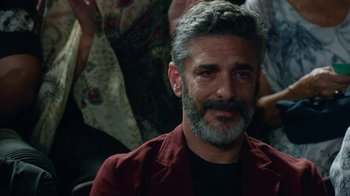 Movie still from “Pain and Glory” (2019), directed by Pedro Almodóvar – A person wearing a red shirt; Close Up shot, Over the shoulder angle