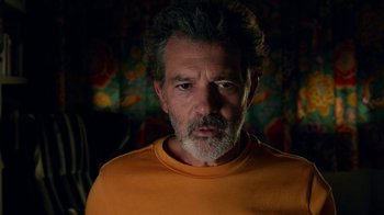 Movie still from “Pain and Glory” (2019), directed by Pedro Almodóvar – A person wearing an orange t - shirt; Close Up shot, Low angle