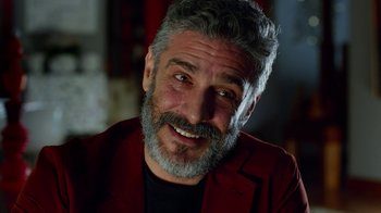 Movie still from “Pain and Glory” (2019), directed by Pedro Almodóvar – A person wearing a jacket; Close Up shot, Over the shoulder angle