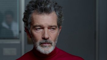 Movie still from “Pain and Glory” (2019), directed by Pedro Almodóvar – A person wearing a red shirt; Close Up shot, Over the shoulder angle