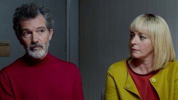 Movie still from “Pain and Glory” (2019), directed by Pedro Almodóvar – A man and a woman standing next to each other; Medium shot, Over the shoulder angle
