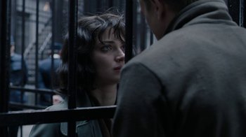 Movie still from “Papillon” (2017), directed by Michael Noer – A man and a woman looking at each other through a fence; Close Up shot, Over the shoulder angle