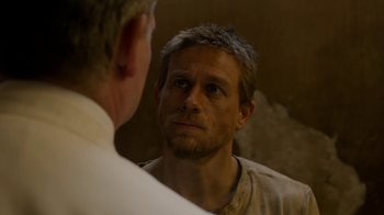 Movie still from “Papillon” (2017), directed by Michael Noer – A person looking at a mirror; Close Up shot, Over the shoulder angle