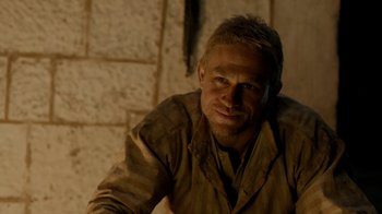 Movie still from “Papillon” (2017), directed by Michael Noer – A person wearing a jacket; Close Up shot, Over the shoulder angle