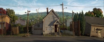 Movie still from “ParaNorman” (2012), directed by Sam Fell – An old house in a residential area with a fence; Extreme Wide shot, High angle