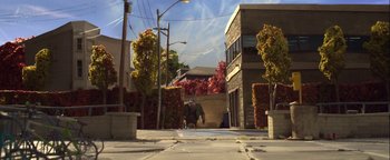 Movie still from “ParaNorman” (2012), directed by Sam Fell – A man walking down the street with a skateboard; Extreme Wide shot, Low angle