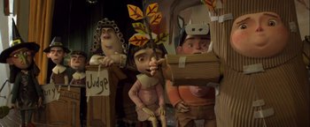 Movie still from “ParaNorman” (2012), directed by Sam Fell – A group of statues of people; Medium shot, Low angle