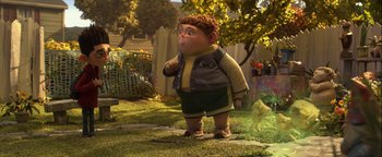Movie still from “ParaNorman” (2012), directed by Sam Fell – A cartoon character is standing in the grass; Wide shot, High angle