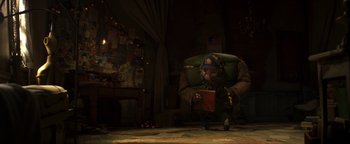 Movie still from “ParaNorman” (2012), directed by Sam Fell – An old man is holding a book in a room; Wide shot, Low angle