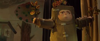 Movie still from “ParaNorman” (2012), directed by Sam Fell – A paper mache doll holding a stick of paper; Medium shot, Low angle