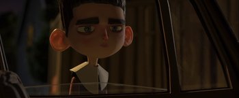 Movie still from “ParaNorman” (2012), directed by Sam Fell – The head of a cartoon character in a car window; Close Up shot, Over the shoulder angle