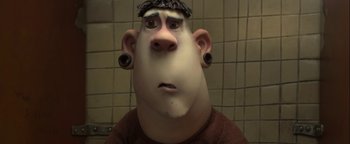 Movie still from “ParaNorman” (2012), directed by Sam Fell – An animated man with a black hat is looking at the camera; Close Up shot, High angle