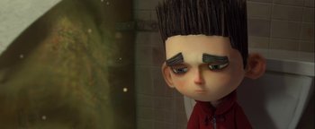 Movie still from “ParaNorman” (2012), directed by Sam Fell – A doll's face with a weird hair style; Close Up shot, Low angle